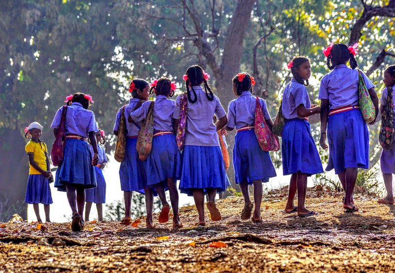 Left: Educating their children is an important priority. A group of girls walking to school from the village.