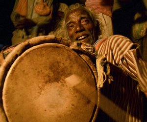 Man playing traditional instruments