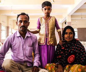 Young girl with parents at Bijwasan Barat Ghar